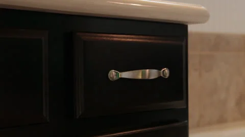 Hand opens &amp; closes bathroom drawer, close-up Video stock 25912729