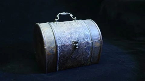 The hand opens, closes the cap of a box (chest) with metal trim in floral style  Stock Footage 121602530