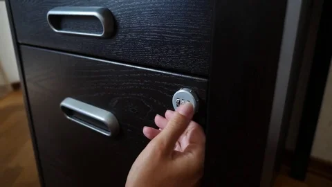 The hand opens the coded lock of the safe. 4k. Slow motion. Stock Footage 78025503
