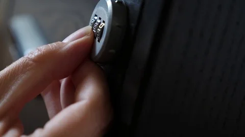 The hand opens the coded lock of the safe. 4k. Slow motion. Stock Footage 78026435