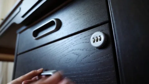 The hand opens the coded lock of the safe. 4k. Slow motion. Stock Footage 78071480