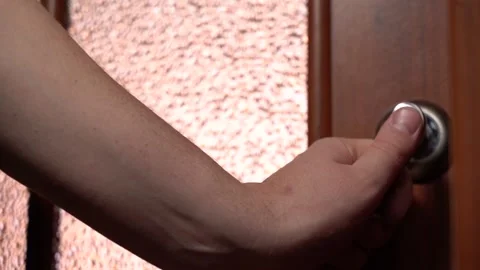 The hand opens the door to a bright room. Home comfort and light of hope Stock Footage 151530983