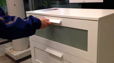 A hand opens a drawer in cabinet Stock Footage 49681635