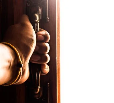 Hand opens empty room door Stock Photos