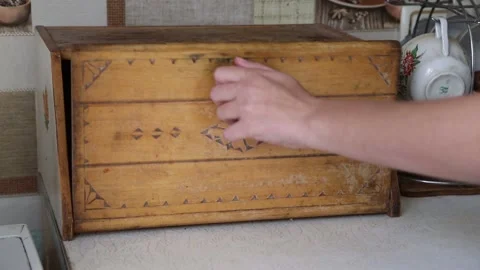 Hand opens an empty wooden bread bin Stock Footage 162025025