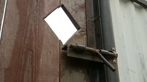 Hand opens the gate bolt Stock Footage 68945820