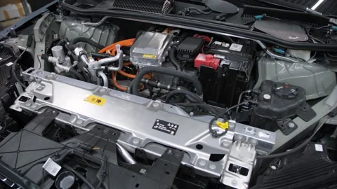 A hand opens the gray hood of the new BMW ix m60 electric car. Video stock 247075971