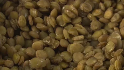 The hand opens the lid of the lentil pan Stock Footage 105188823