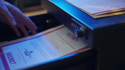 Hand opens metal drawer with passcode, retrieves a secret folder, and shuts it Video stock 304658540