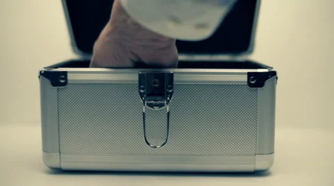 Hand opens a metallic suitcase and trying to find money inside, but empty Stock Footage 59790445