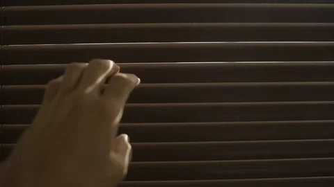 Hand opens office window shutters to look over the city outside Stock Footage 109163938