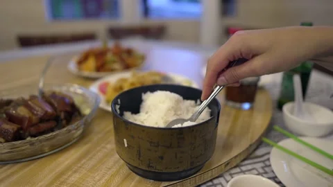 Hand opens rice container and scoops rice Stock Footage 210835151