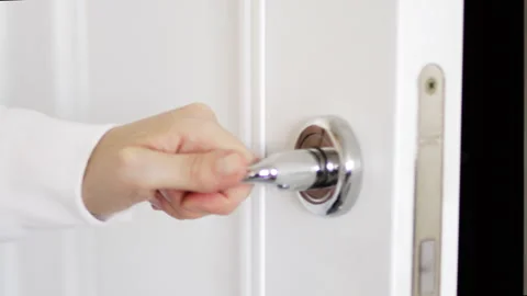 A hand opens a white door room. Stock Footage 246503459