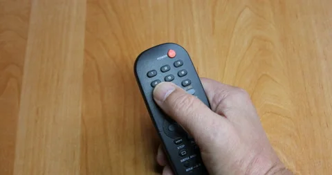 Hand operated black remote control Stock Footage 138206638