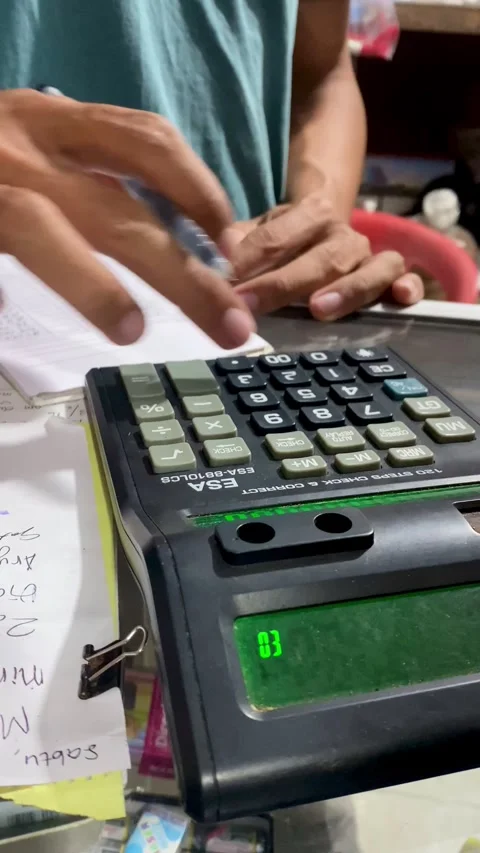 Hand Operating Calculator in Small Local Shop Environment Stock Footage 328420707