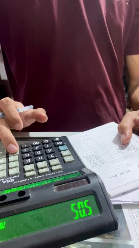 Hand Operating Calculator in Small Local Shop Environment Stock Footage 328575281