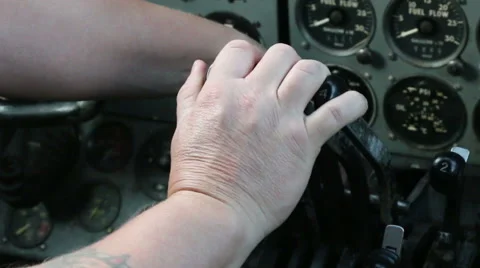 Hand operating engine controls in aircraft 02 Stock Footage 42911759