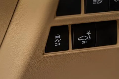 Hand operating ESP (electronic stability program) control close up view. Inte Stock Photos