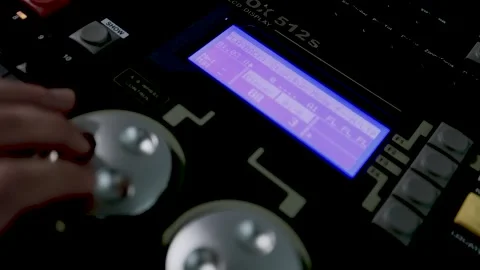 Hand Operating Jog Wheel on Studio Console with Blue Screen Stock Footage 340243095