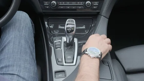Hand operating luxury car console Stock Footage 91450364