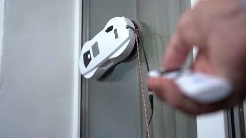 A Hand Operating a Modern Smart Device on a Glass Door, Enhancing Home 스톡 동영상 333514357