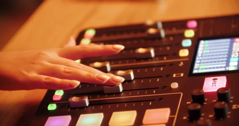 Hand operating slider on digital audio mixer in studio Stock Footage 316248760