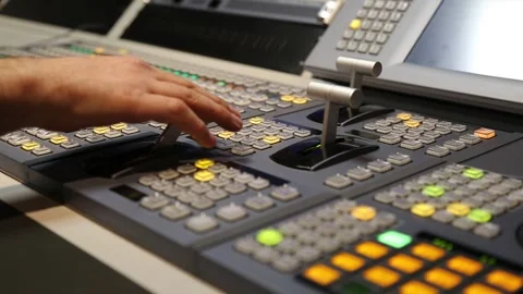 Hand Operating Video Mixer in Broadcast Studio Stock Footage 344910918