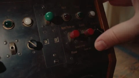 Hand operating vintage telephone switch on analog communication control panel Stock Footage 340490613