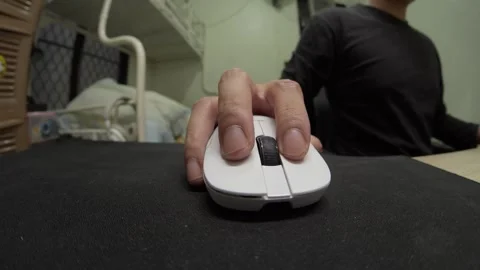 Hand Operating White Computer Mouse on Desk with Wide Fisheye Close Up Indoors Stock Footage 336054986