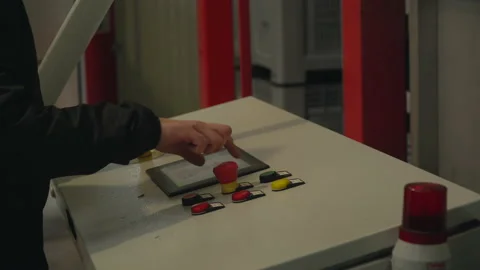 Hand of the operator turning off the flashing emergency bulb on the control Stock Footage 151699127