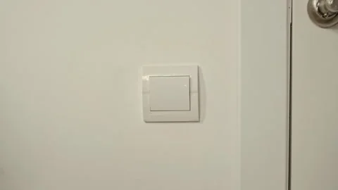 Hand with Orange Glove Cleaning Switch on White Wall Stock Footage 308469397
