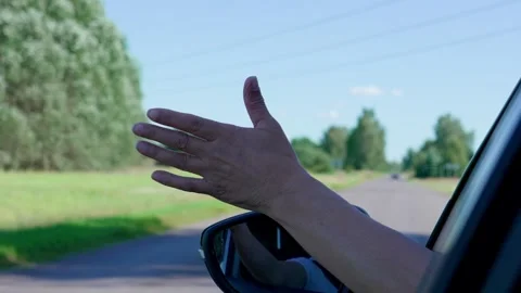 Hand out of a car window. Stock Footage 320711803