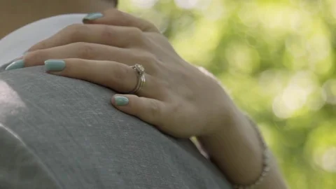 Hand over shoulder of husband with ring. Stock Footage 85224455