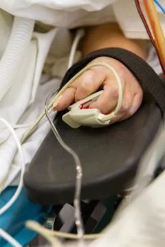 Hand with an oximeter Stock Photos