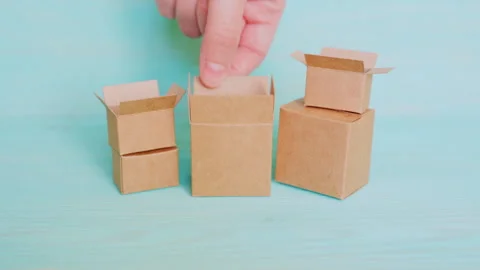 Hand Packing Miniature Cardboard Boxes with Roasted Coffee Beans Stock Footage 297950708