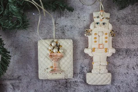 Hand painted Christmas gingerbread nutcracker on a beautiful grey background Stock Photos