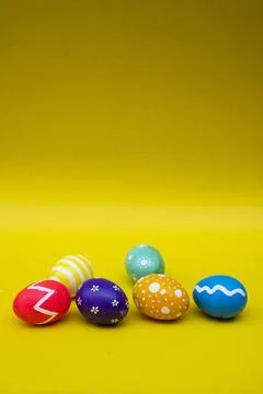 Hand Painted Easter Eggs on Clean yellow Background Foto stock