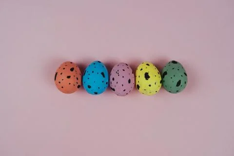 Hand painted Easter eggs isolated on pink background. Quail eggs. Happy Easter Stock Photos