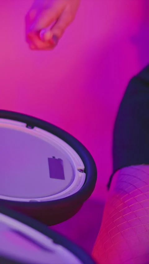 Hand with Painted Nails Holds Red Marker Over Open Container Lid in Pink Purple Stock Footage 346794631