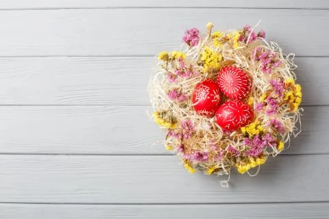 Hand painted red easter eggs on wooden table Stock Photos