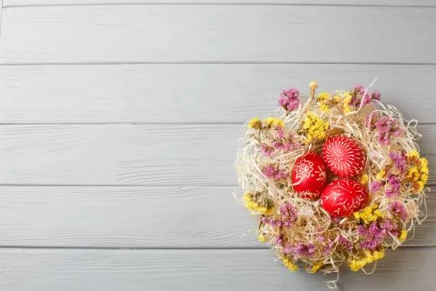 Hand painted red easter eggs on wooden table 스톡 사진