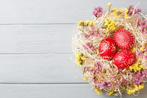 Hand painted red easter eggs on wooden table Stock Photos