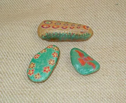 Hand painted stones Stock Photos