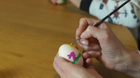 Hand Painting Easter Chick Icon on White Eggshell Stock Footage 329248197