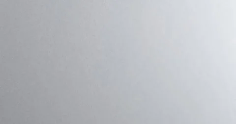 Hand paints gray wall with roller, spreading fresh coating across surface. .. Stock Footage 348444634