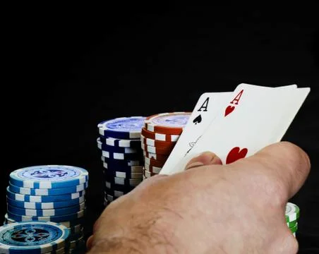 Hand with a pair of aces Stock Photos