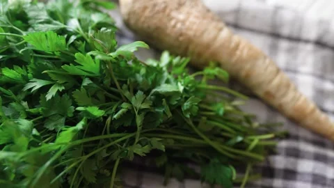 Hand with parsley at a window. Window garden concept. Stock Footage 315590553