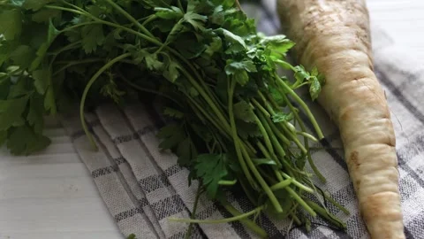 Hand with parsley at a window. Window garden concept. Stock-Footage 315590559