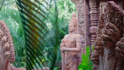 Hand passing on the stone, exotic sculpture of tropical temple.  Stock Footage 219508453