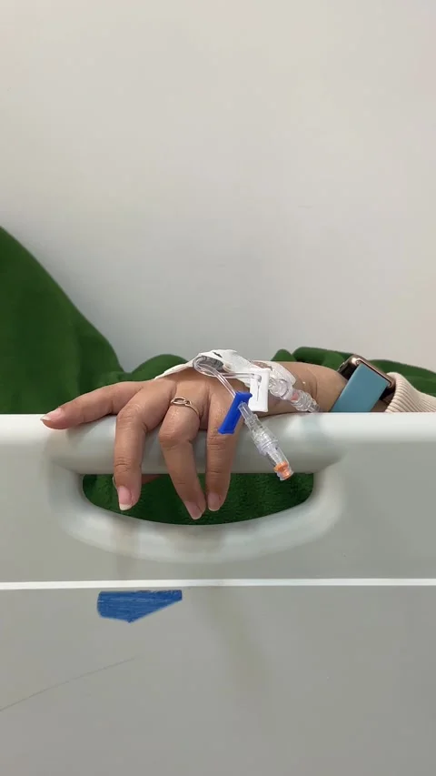 Hand of a patient with catheterization system. Concept of emergency and healt Stock Footage 297419044